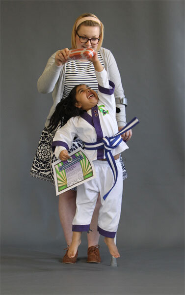 Lil Dragon jumping for the belt she is being awarded belt at the Halifax Warrior Factory