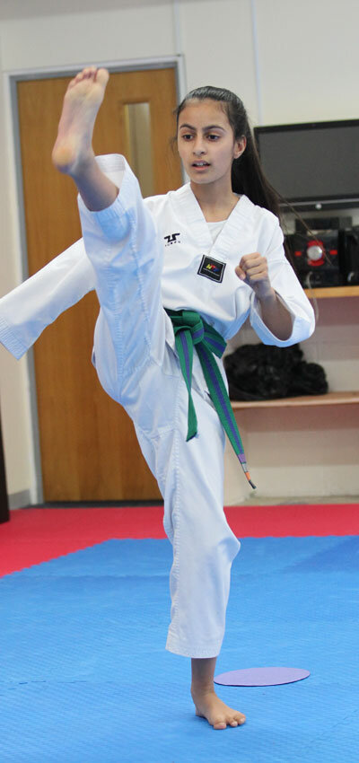 Junior Taekwondo Girl Kicking