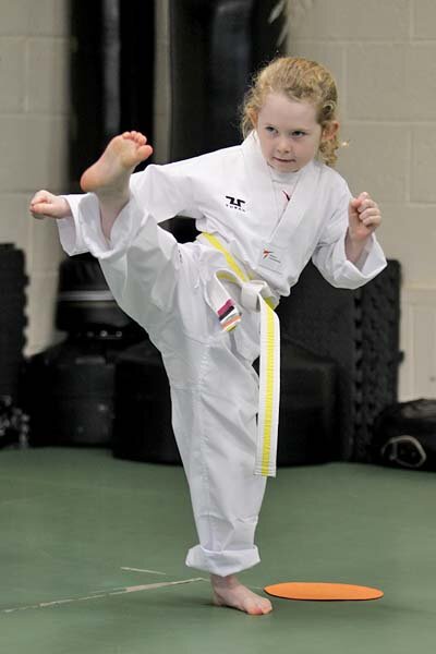 Young Halifax Taekwondo member kicking